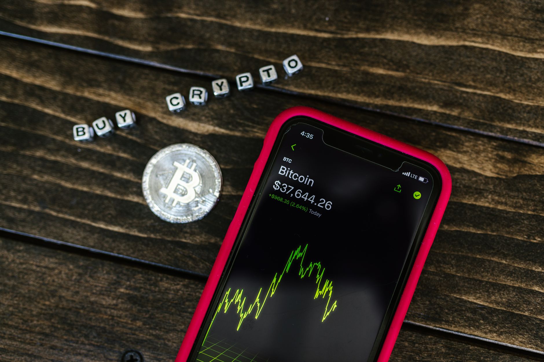 A person reviews a crypto wallet transaction on a screen, illustrating the FCA's proposed monitoring guidance.
