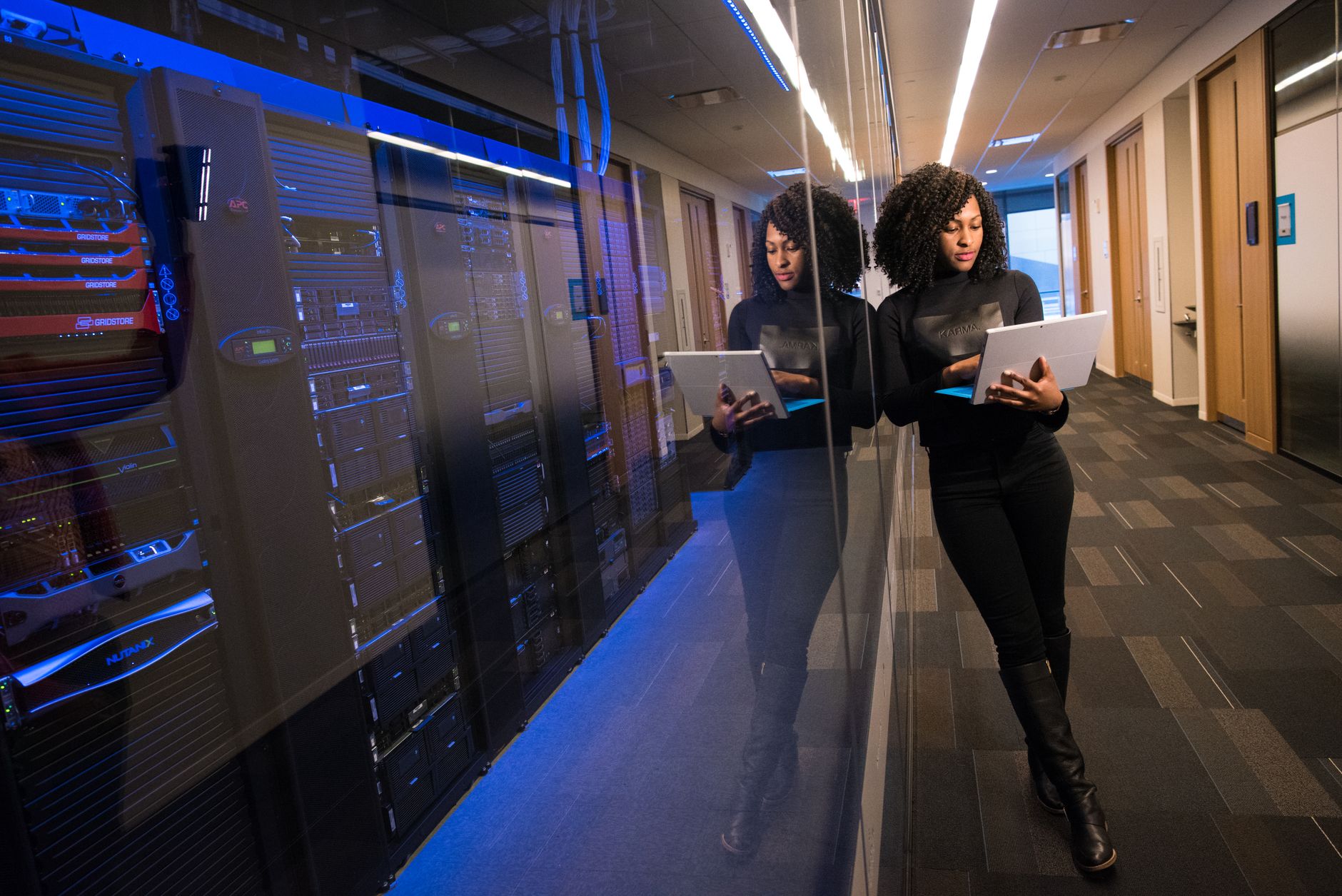 Server racks in a computer room, illustrating the trading server breach at GMO Internet Group