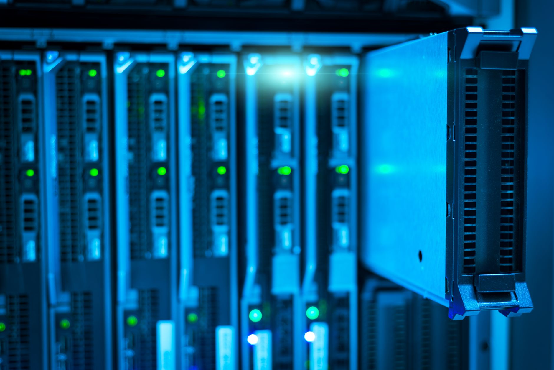 A technician checks server equipment during a broker security response.