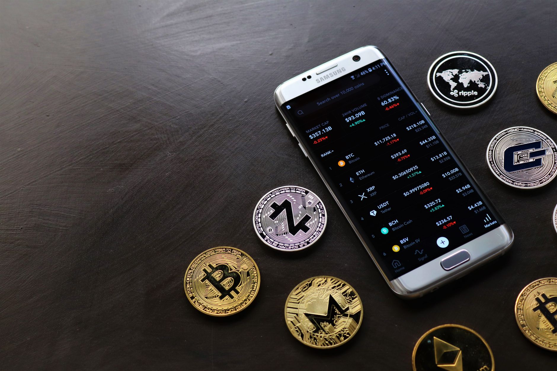 A smartphone with a digital payment screen beside a laptop, representing crypto account funding.