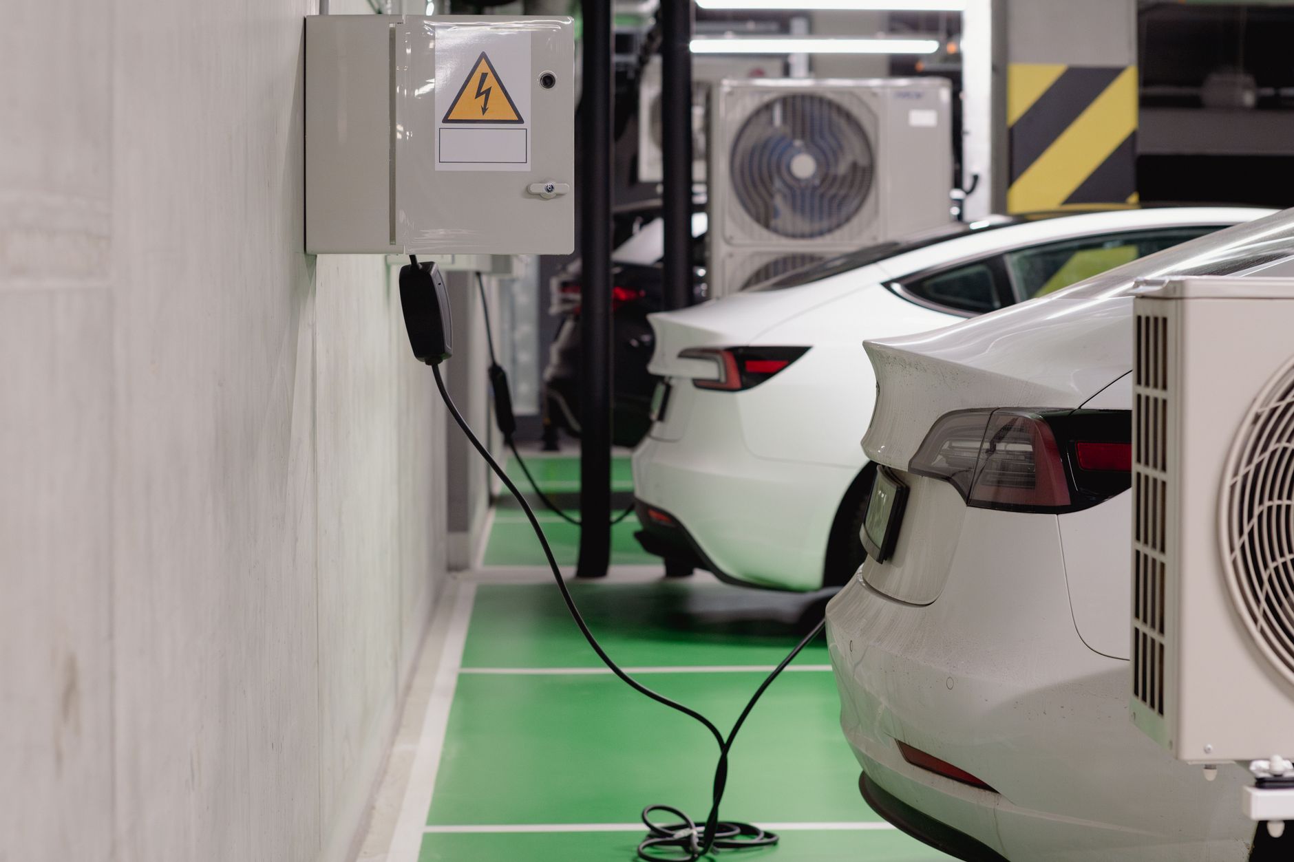 Electric car inside a factory, illustrating Tesla ahead of its quarterly results